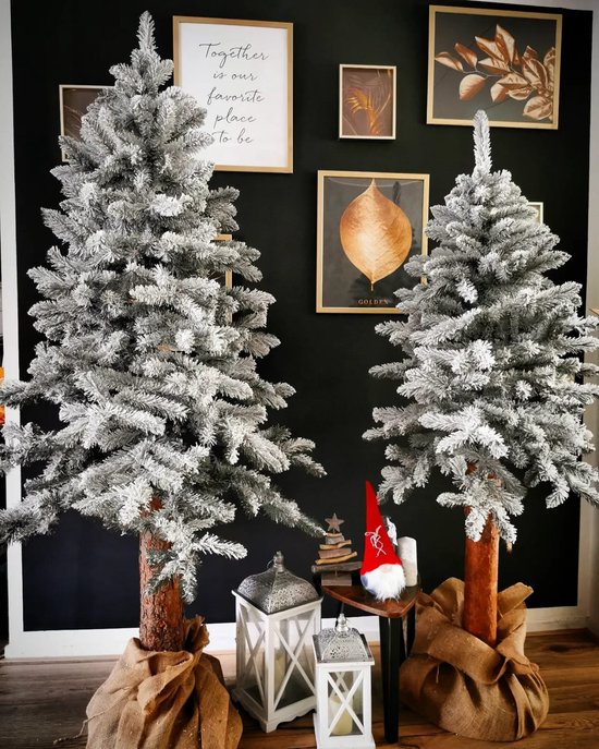 Kunstkerstboom 180cm op houten stam besneeuwd