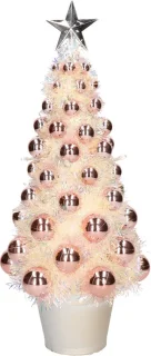 Kunstkerstboom met lichtjes en ballen in zalmroze